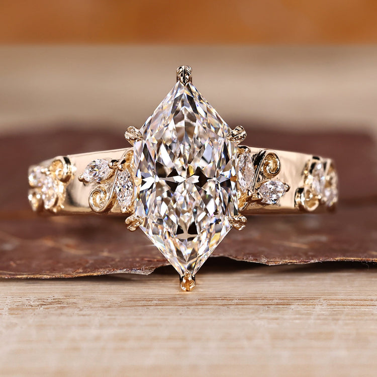 Dutch marquise ring with marquise side stone.