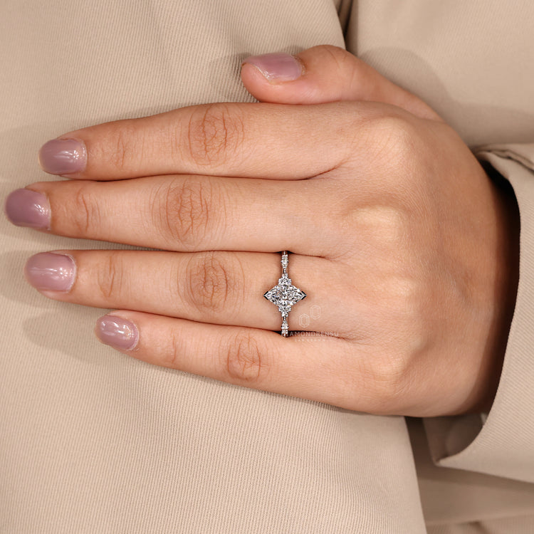 Dutch marquise ring milgrain v prong cluster setting.