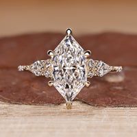 Dutch marquise cut diamond ring kite side stones.