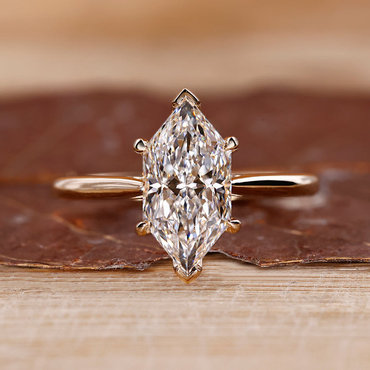 Dutch marquise diamond ring hidden halo v prong set.