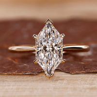 Dutch marquise diamond ring hidden halo v prong set.