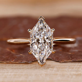 Dutch marquise diamond ring hidden halo v prong set.