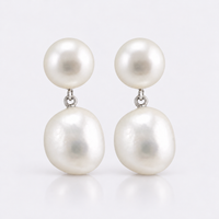White semi-baroque freshwater pearl hanging from button pearl stud earrings