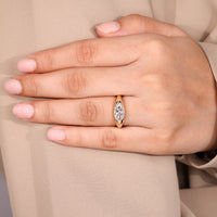 Solitaire style marquise diamond engagement ring.