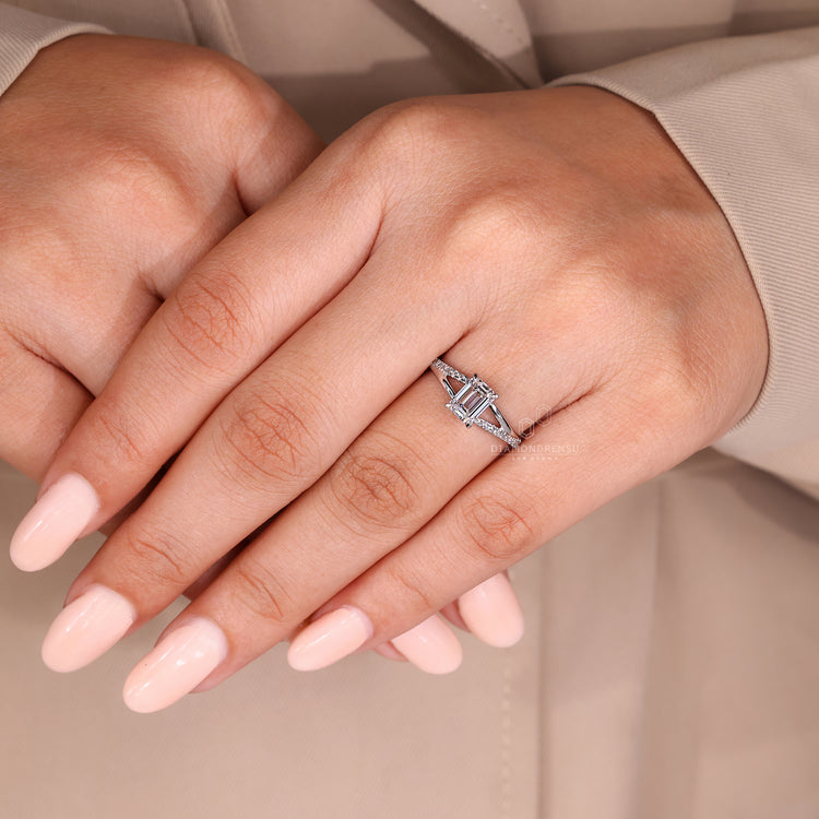 Emerald cut diamond ring IGI certified four claw setting.