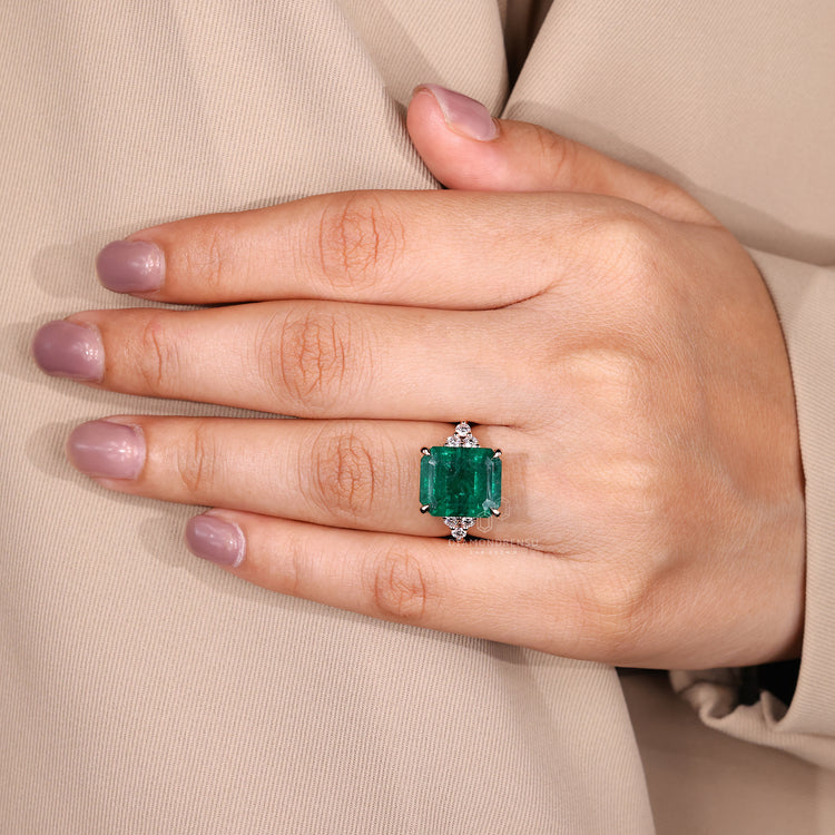 Emerald gemstone ring tapered shank muse style.