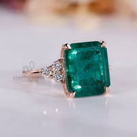 Seven stone emerald ring four claw prong setting.