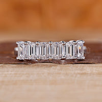 Six stone emerald cut diamond wedding band design.