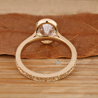 Oval cut ring with Art Deco milgrain details.
