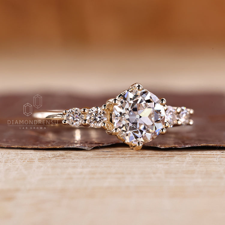 Lab grown round old cut ring five stone six prong.
