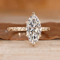 Marquise diamond ring with flower style shank.