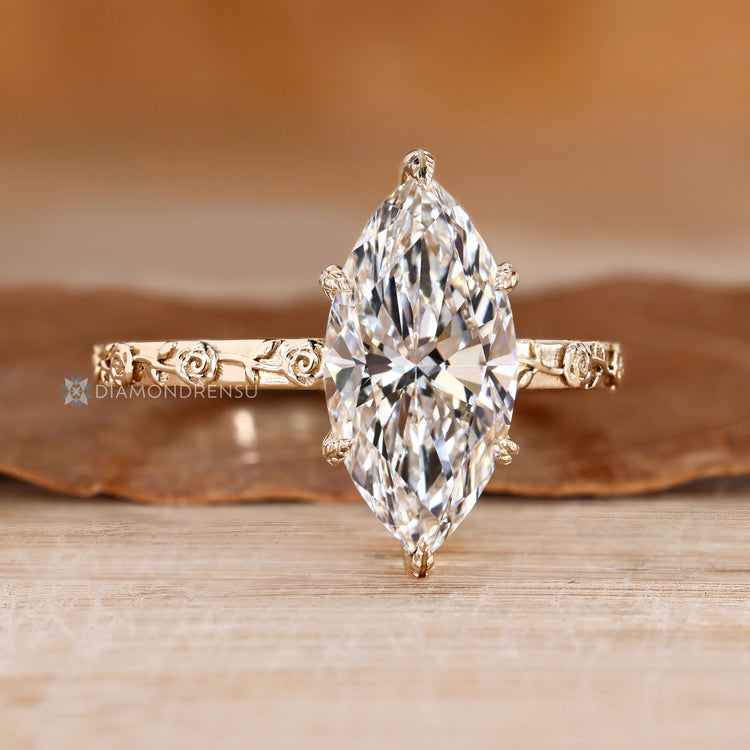 Marquise diamond ring with flower style shank.