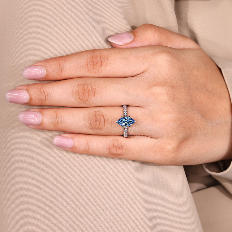 Lab grown diamond marquise ring with sapphire detail.