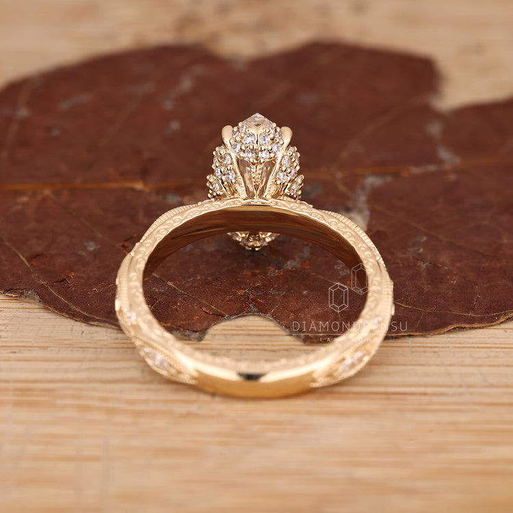 IGI certified marquise diamond ring milgrain style.