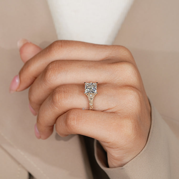Handmade princess cut diamond ring with milgrain details.