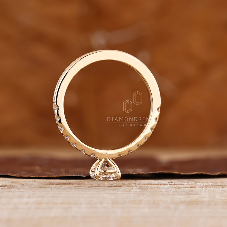Round diamond ring with sparkling pave band.