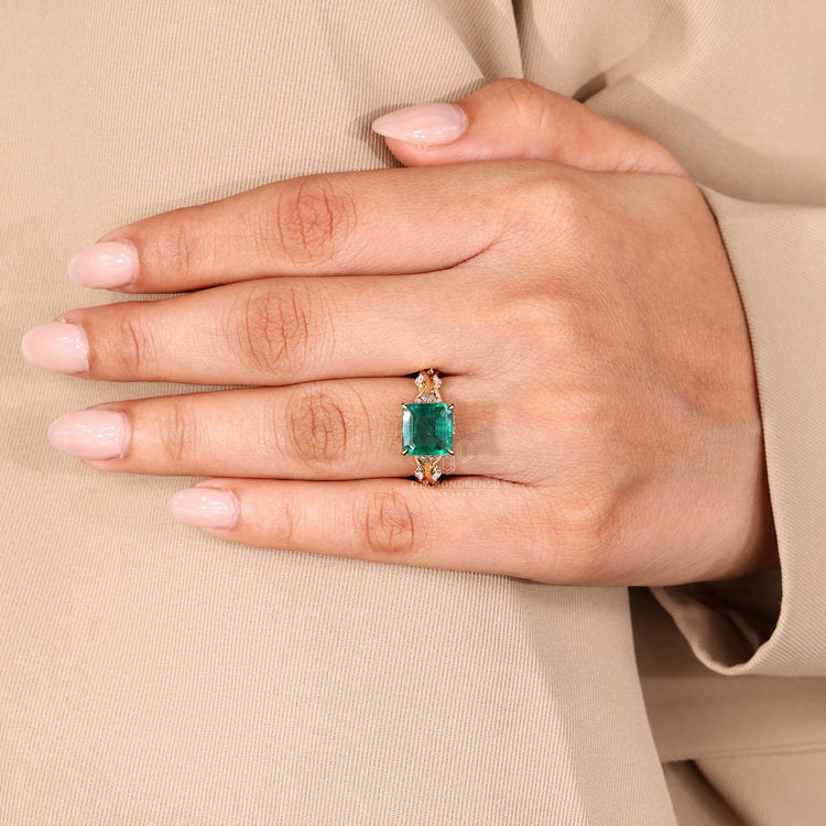 Nature inspired emerald ring marquise cluster setting.