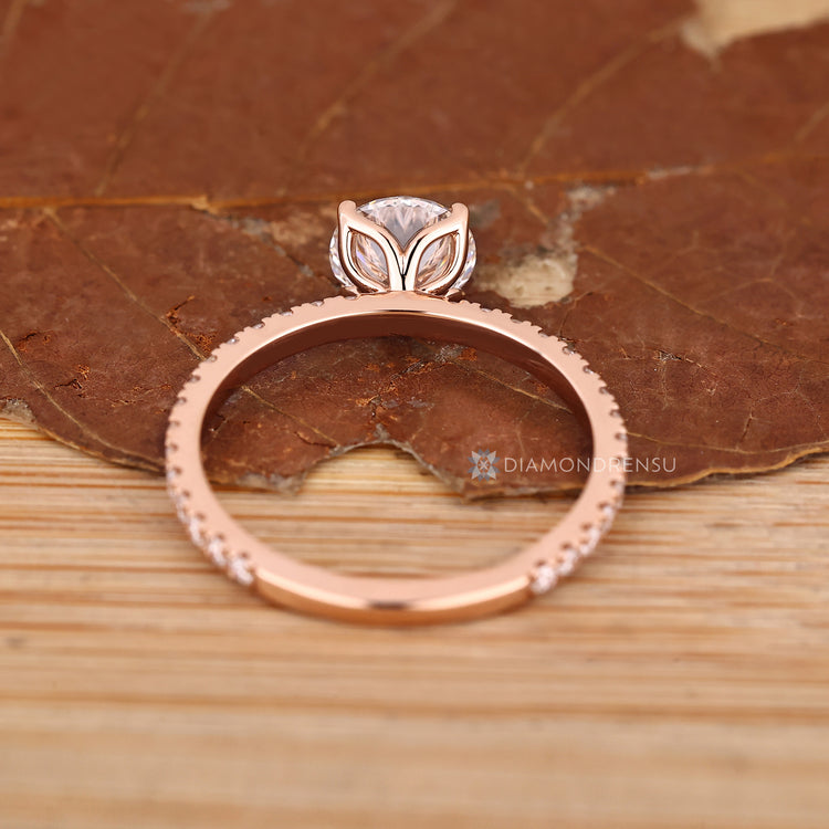 IGI certified round diamond ring with four prongs.