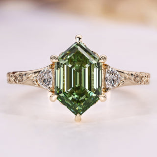 Hexagon diamond ring with trillion cut side stones.