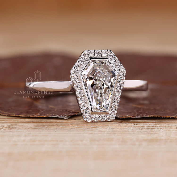 Halo coffin diamond ring open gallery style.
