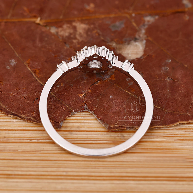 IGI certified round diamond ring four prong cluster.
