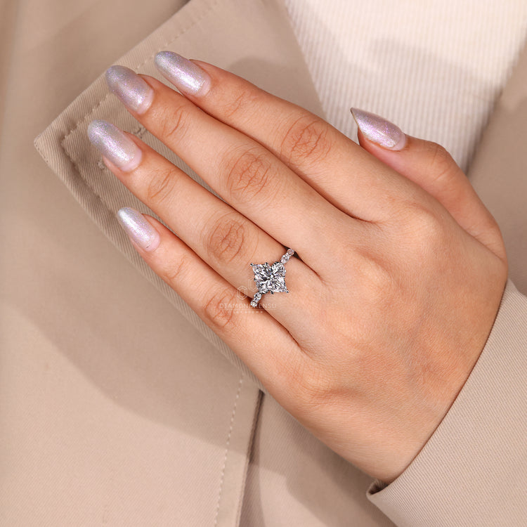 Marquise cut diamond ring with six leaf style prong.
