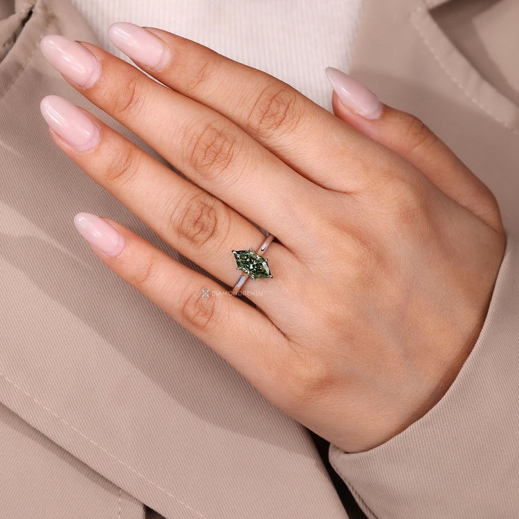 Green diamond Dutch marquise solitaire ring.