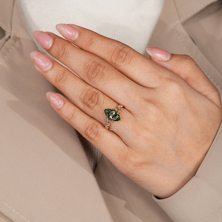 Marquise cut ring with round diamond side stones.