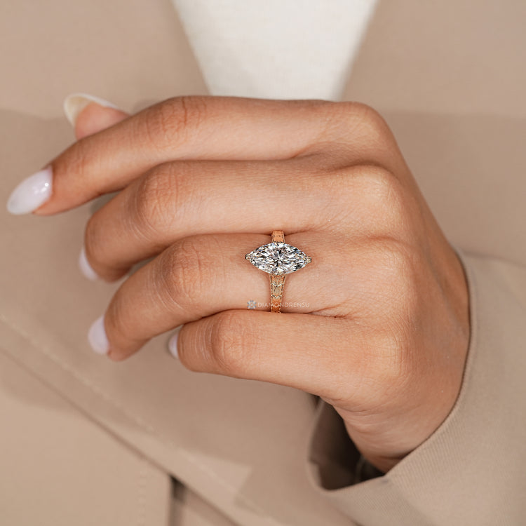 Lab grown marquise diamond ring with tulip basket.