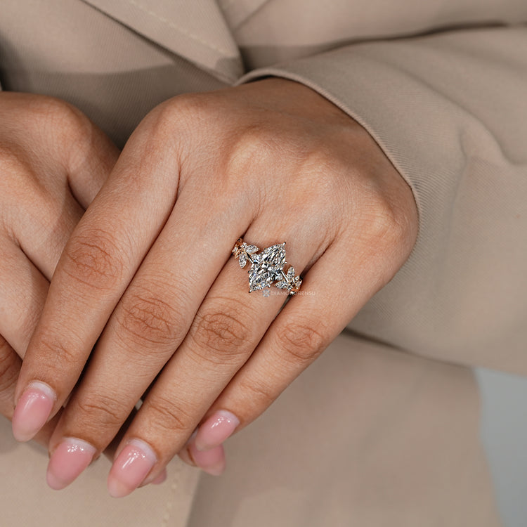 Marquise diamond ring with nature inspired cluster design.