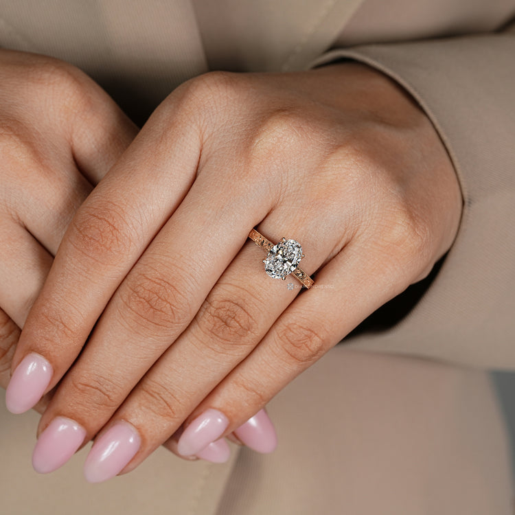 Vintage oval diamond ring with milgrain setting.