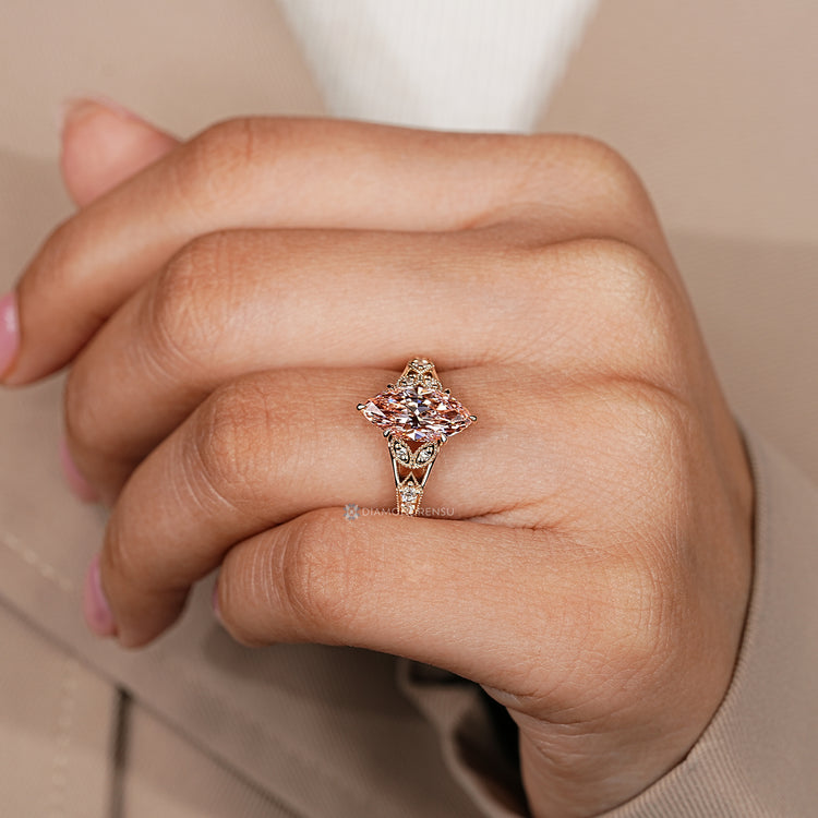 Lab grown marquise diamond ring with six claw prongs.