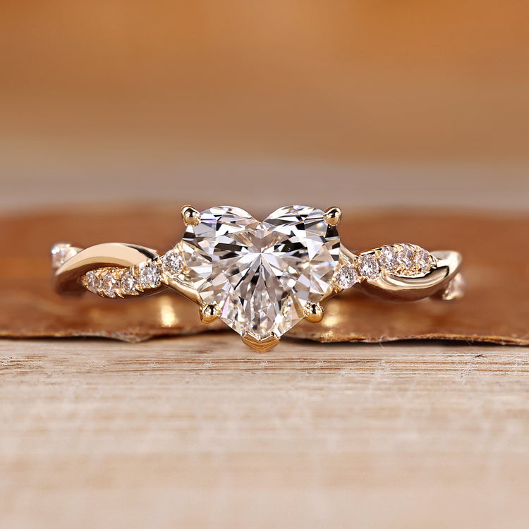 Heart cut diamond ring with twisted pave style.