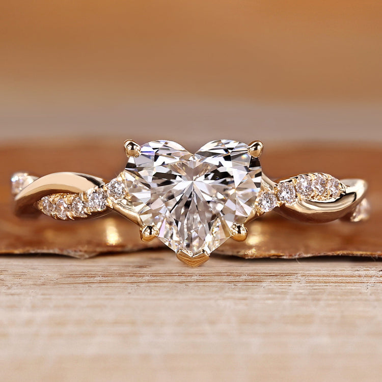 Heart cut diamond ring with twisted pave style.