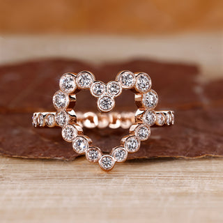 Bezel diamond ring with round diamond centre.