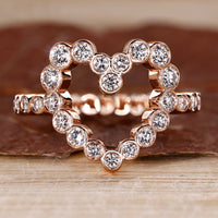 Bezel diamond ring with round diamond centre.