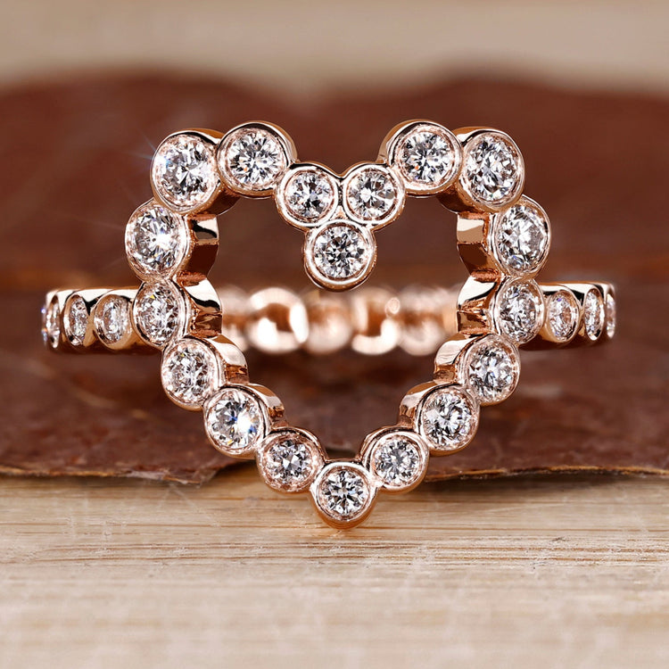 Bezel diamond ring with round diamond centre.