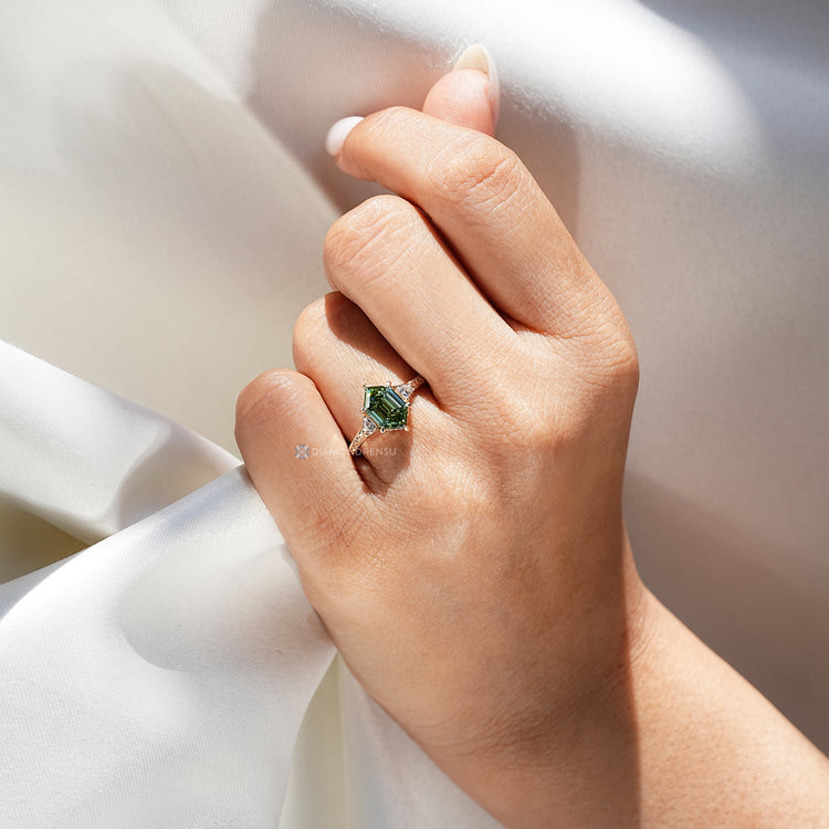 Art Deco hexagon diamond ring with trillion side stones.