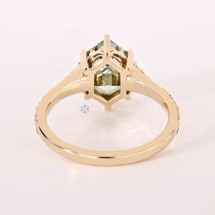Hexagon diamond ring with nature inspired design.