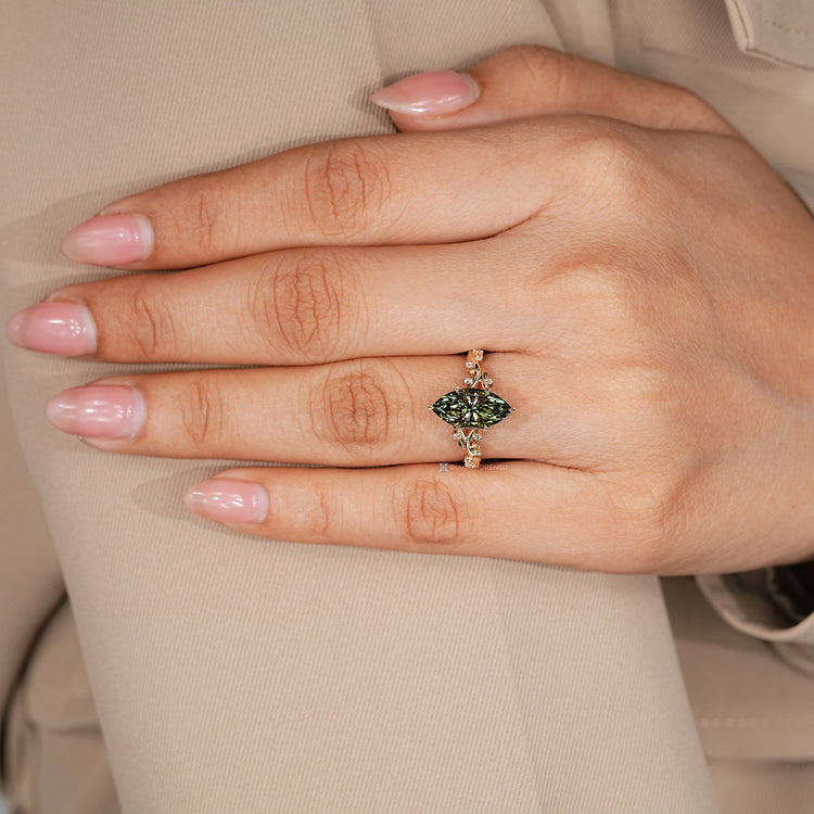 Marquise cut diamond ring with hidden blue topaz.