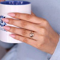 Cushion rose cut ring solitaire bezel setting style.
