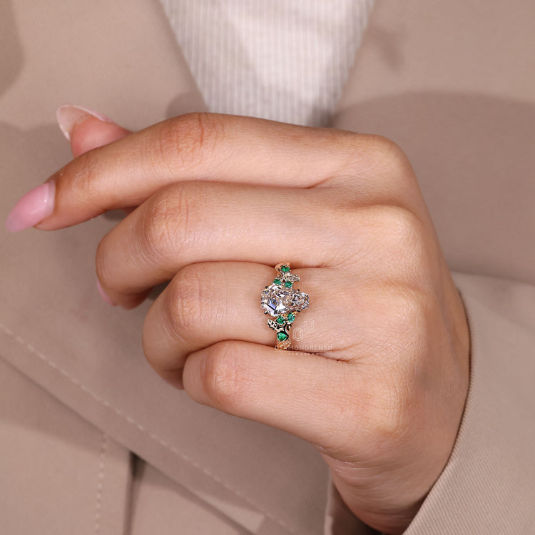 Coffin cut ring round emerald stones design.