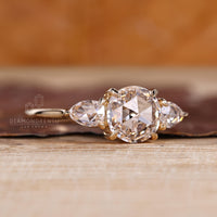 Handmade four claw prong rose cut diamond ring.