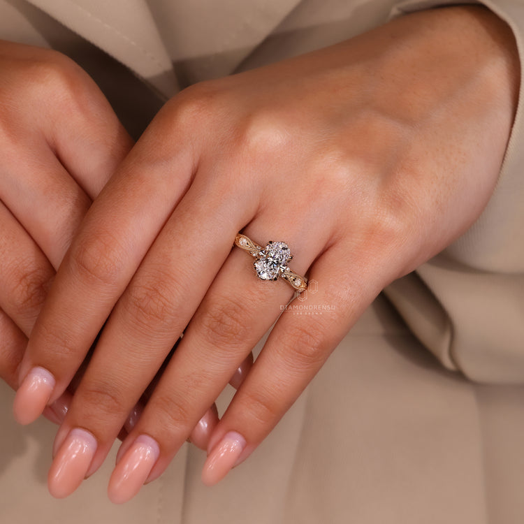 Vintage engagement ring uses marquise and round side stones.