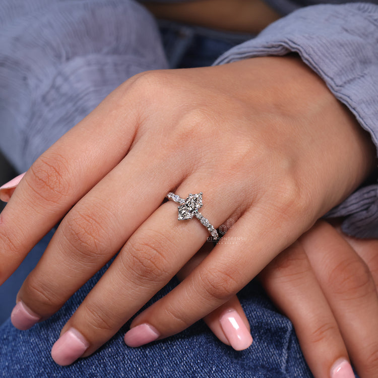 Round cut pave setting diamond engagement ring.