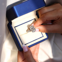 Pave round diamond ring featuring oval centre stone.