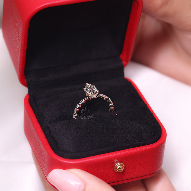 5 claw prong setting pear diamond ring.