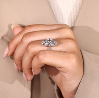 Handmade ring with marquise diamond and five stone design.