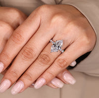 Five stone diamond ring with six claw setting.