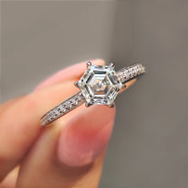Hexagon Engagement Ring in white gold with round cut pave setting.